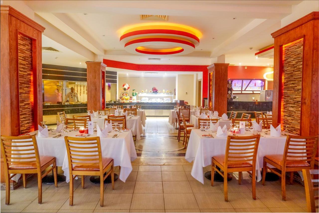Hotel Charmillion Club Aquapark à Charm el-Cheikh Extérieur photo The interior of the restaurant